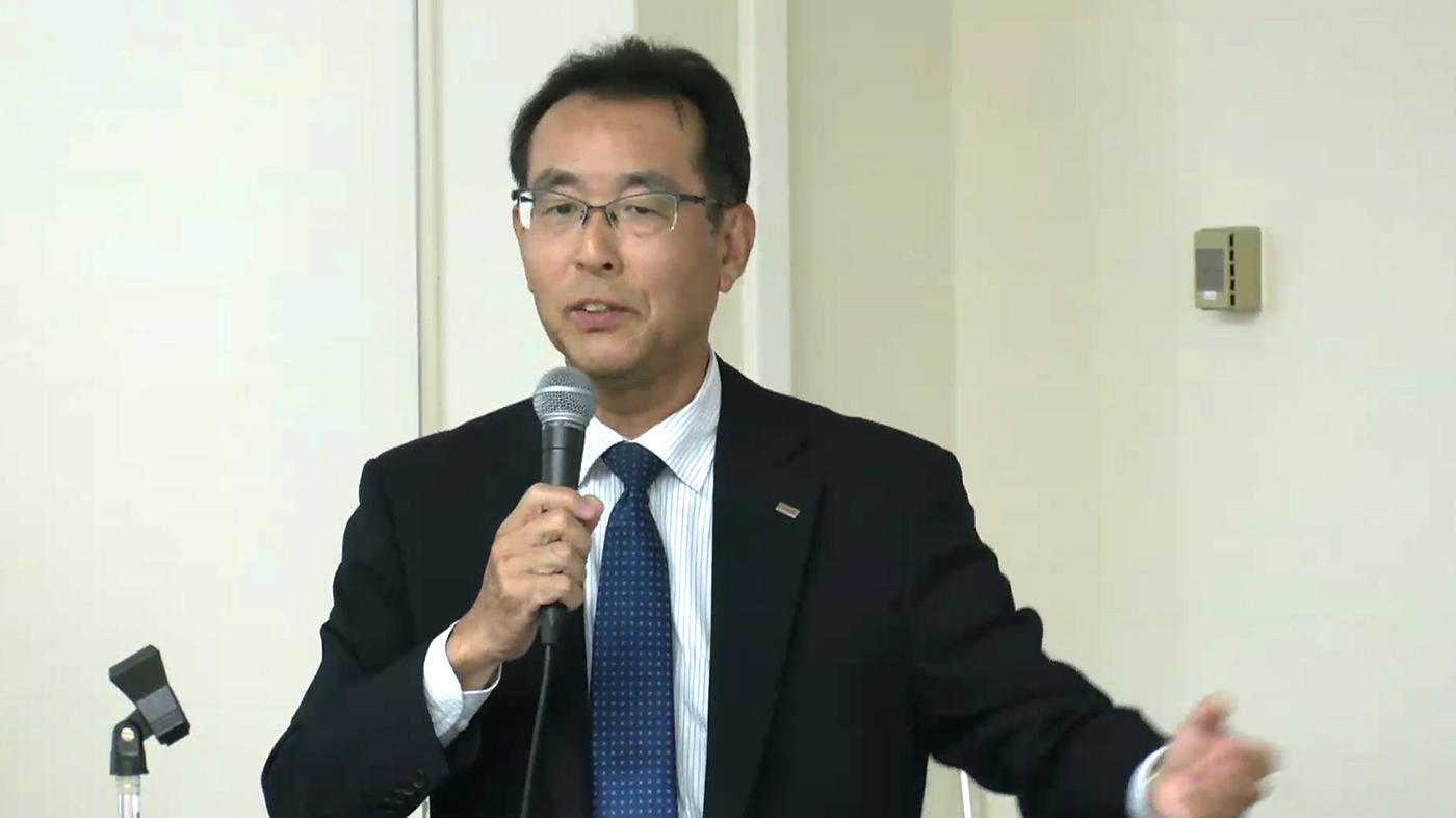 シンポジウムで報告する廣田孝司社長（PC画面のスクリーンショット）